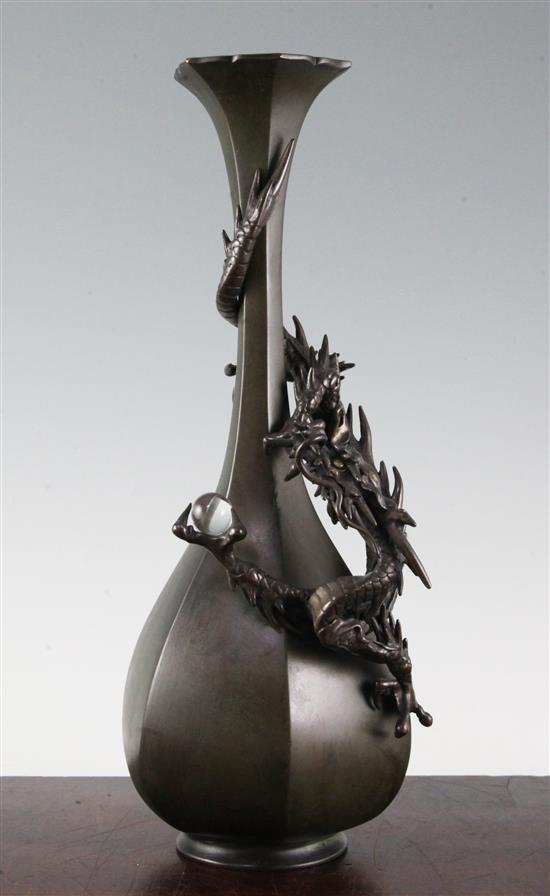 A Japanese bronze dragon hexagonal bottle vase, c.1880, 35.5cm